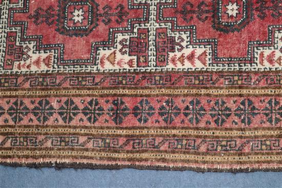 A Tekke Bokhara rug and a similar smaller rug 200 x 128cm and 165 x 95cm